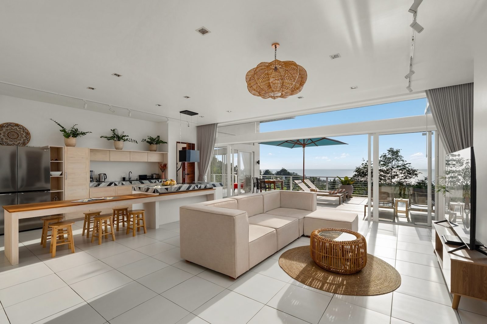 Open-plan kitchen and dining with sea view